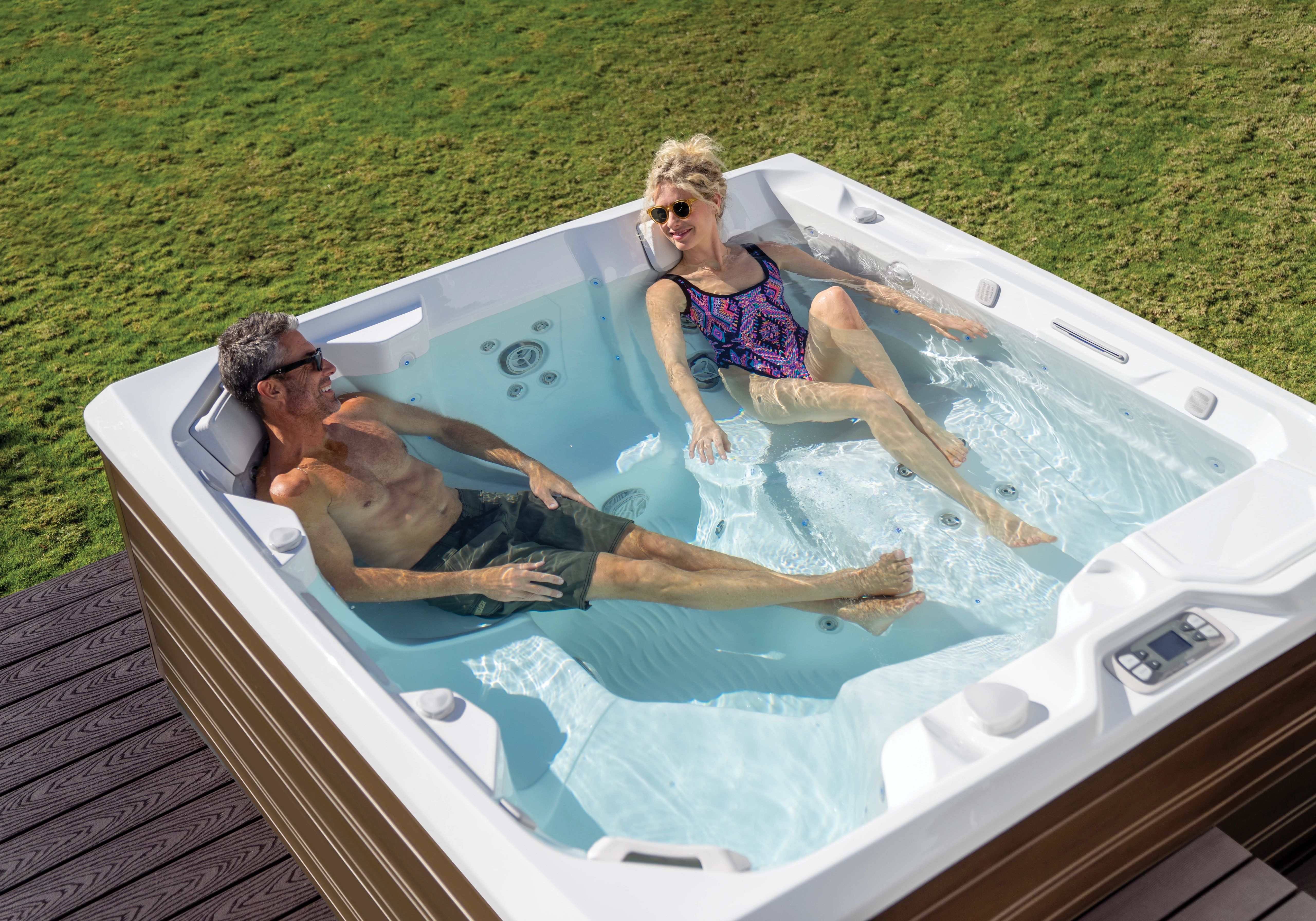 Couple in hot tub in Summer