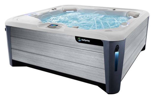 A product shot of a HotSpring Highlife hot tub filled with water and isolated against a white background