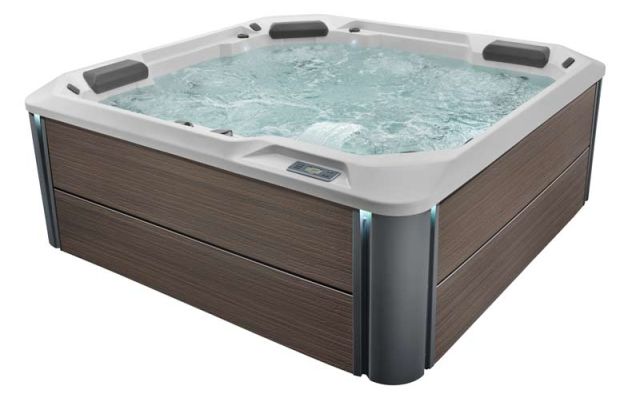 A product shot of a HotSpring Hotspot hot tub filled with water and isolated against a white background