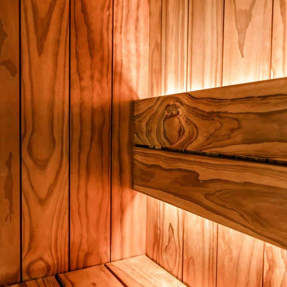 The wooden interior of a sauna
