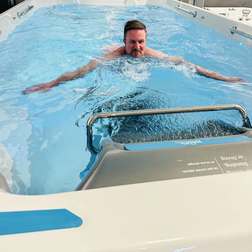 Man using Endless Pool and Hydrodrive Current