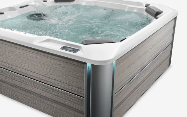 A filled Rhythm hot tub with jets on