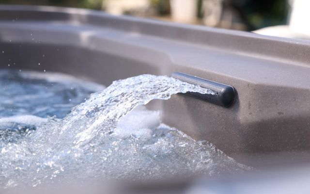 young girl enjoys freeflow hot tub