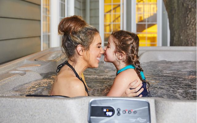 woman relaxes in freeflow hot tub
