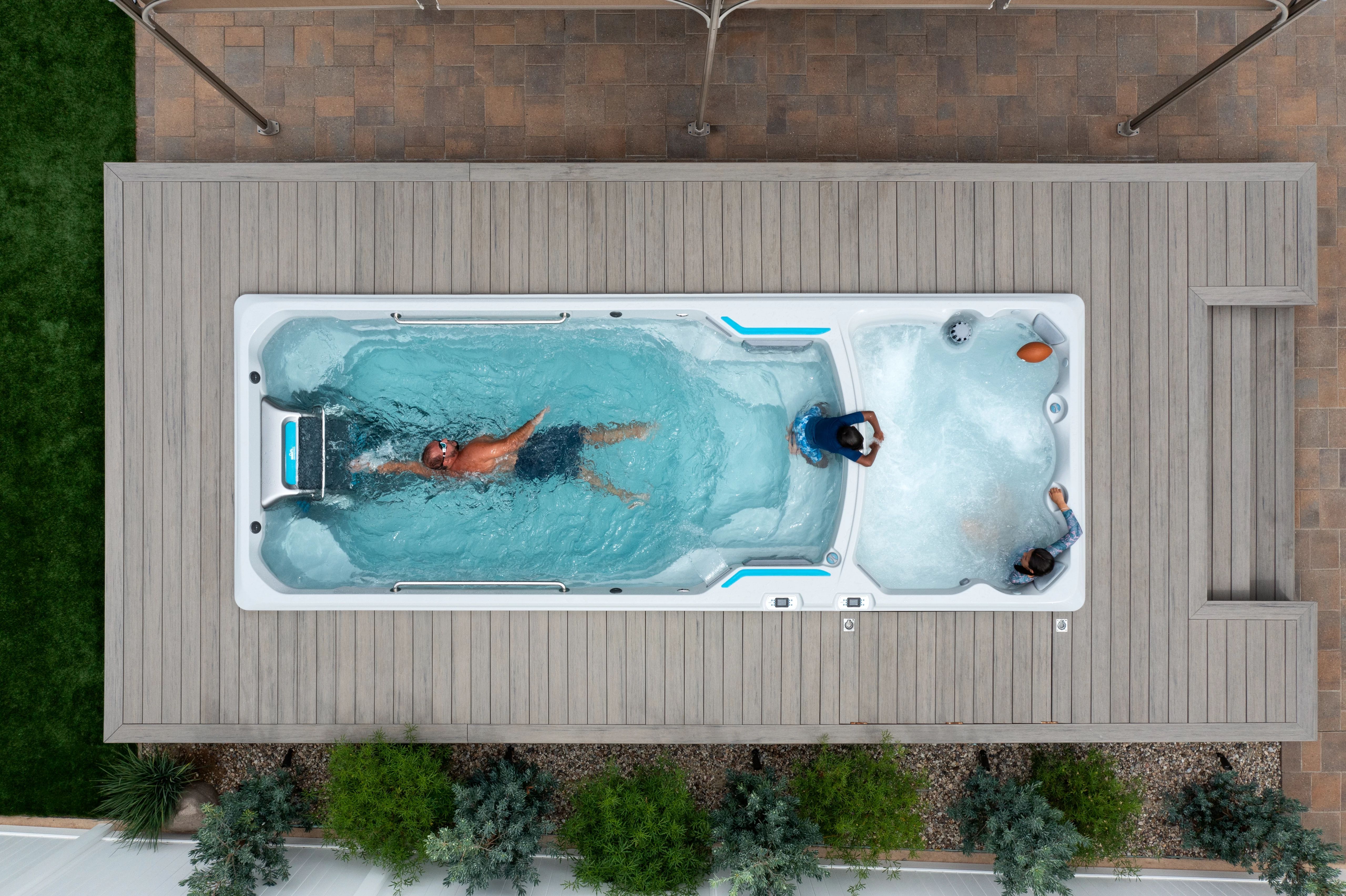 Man swimming in dual temp swim spa