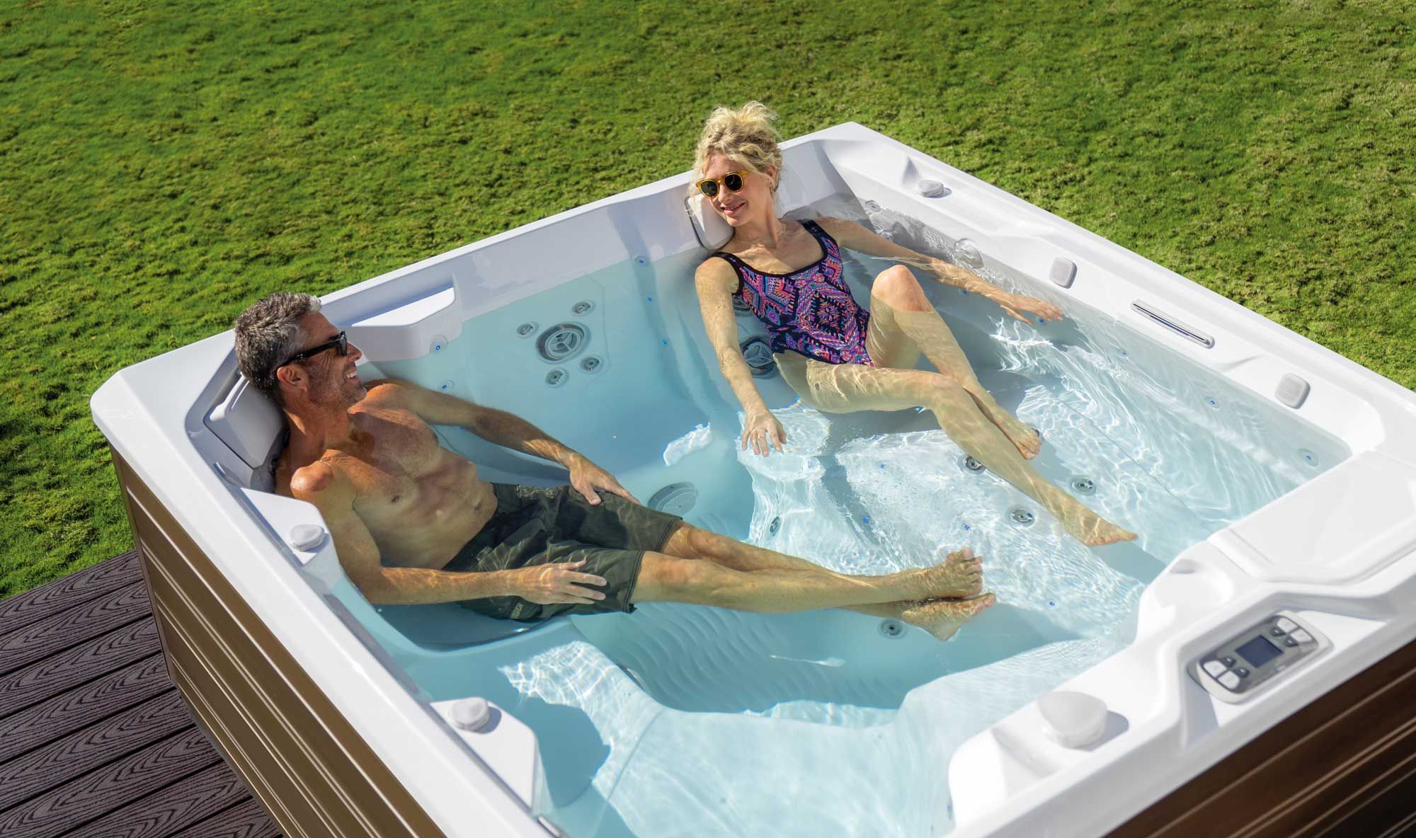 a couple relax in a hot tub