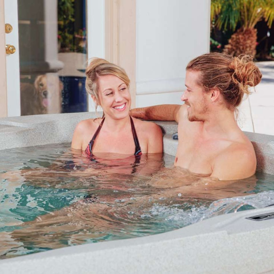 Couple relaxing in hot tub