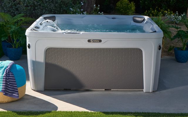 young girl enjoys freeflow hot tub