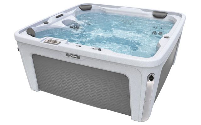 A product shot of a HotSpring Hotspot hot tub filled with water and isolated against a white background