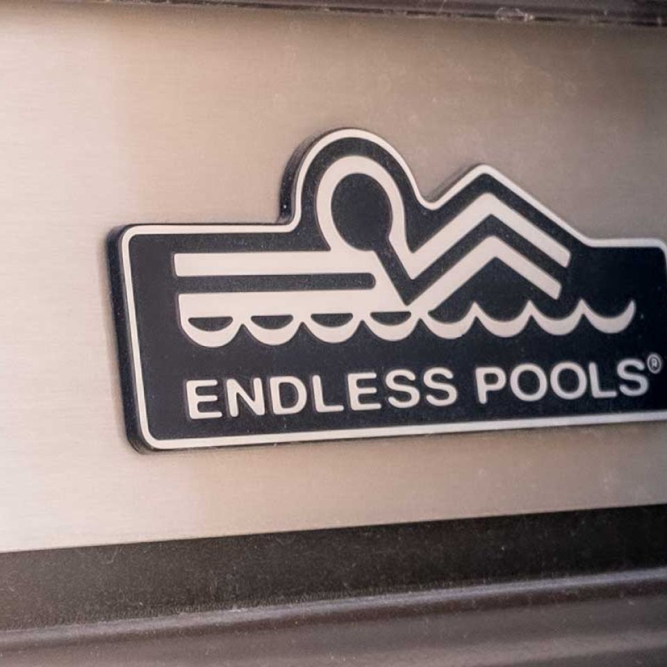 The endless pools badge on the side of one of their swim spas