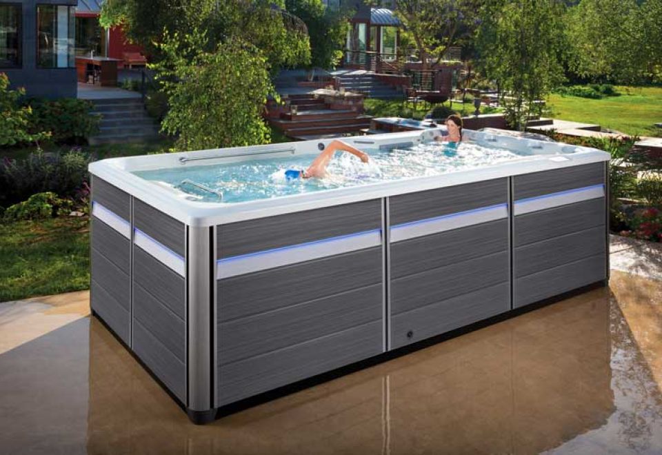 man swims in swim spa