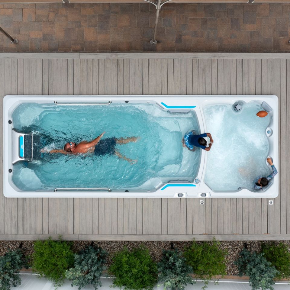 Man swimming in dual temp swim spa