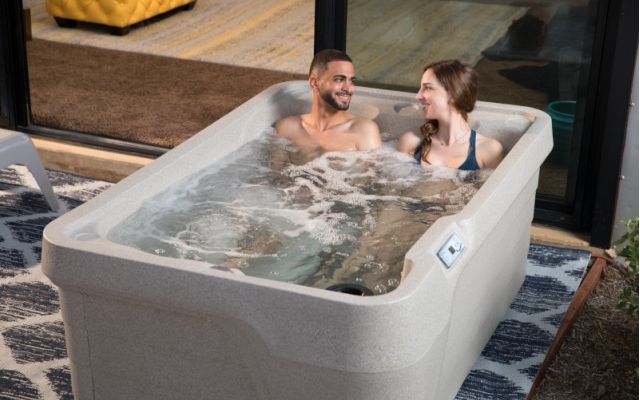 young girl enjoys freeflow hot tub