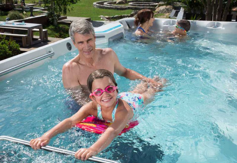 enjoying family time in swim spa