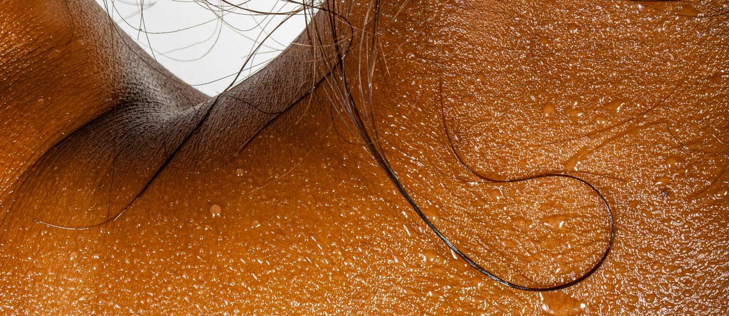 beads of sweat on a woman's back