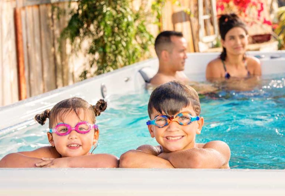 happy kids in swim spa