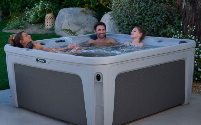 family enjoys freeflow hot tub