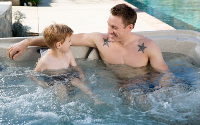 family enjoys freeflow hot tub