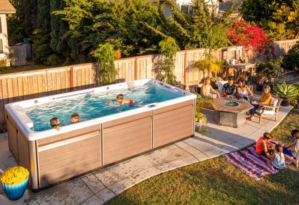 family enjoy swim spa