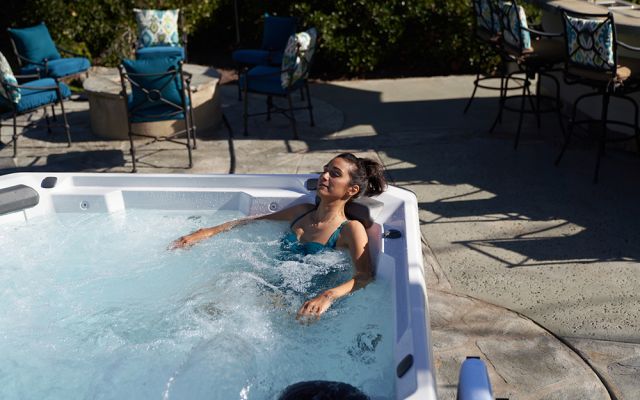 Woman In relaxes Hot Tub