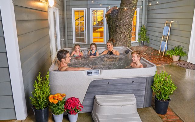 family enjoys freeflow hot tub