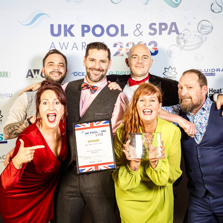 The HTO Team at the UK Pool and Spa awards 2023 holding their award for Spa Team of the Year