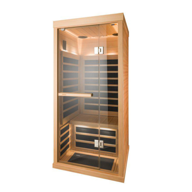 The Tylo T810H infrared sauna cabin with black IR panels and interior lighting, set against a white background.
